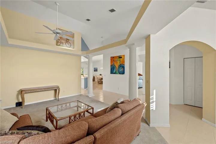 Family room with ceiling fan, lofted ceiling