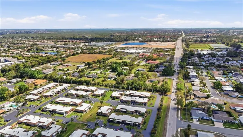 Aerial perspective of suburban area with a nearby body of water