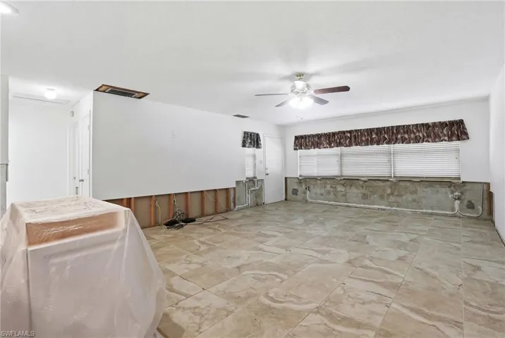View of patio featuring a ceiling fan