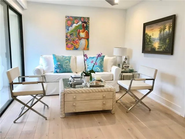 Sitting room with light wood finished floors and baseboards