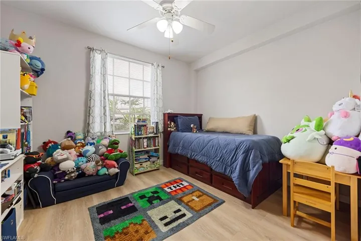 Bedroom featuring light wood-style flooring and ceiling fan