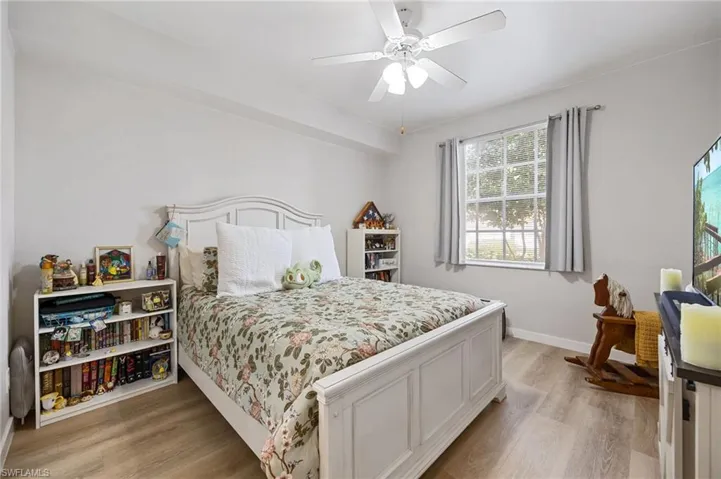 Bedroom featuring light wood finished floors and ceiling fan