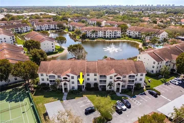 Aerial view of apartment complex and a large body of water