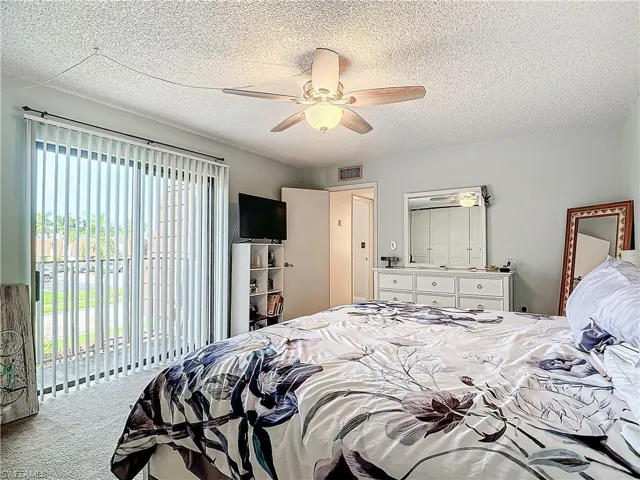 Bedroom with sliders leading to the balcony