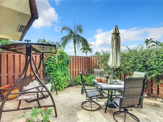 View of patio / terrace featuring fence and outdoor dining space