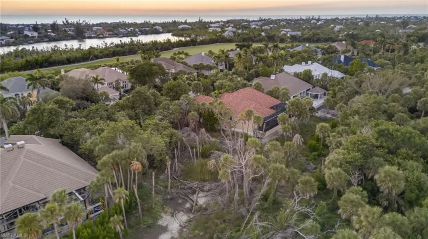 Aerial view at dusk of a water view and a residential view