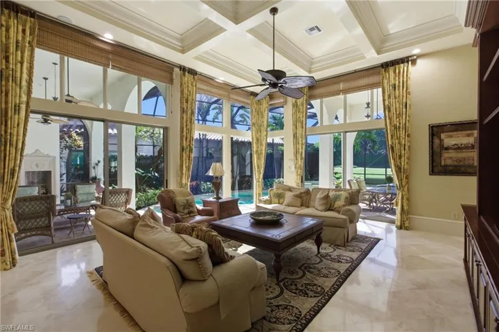 Sunroom featuring healthy amount of natural light, coffered ceiling, and beam ceiling