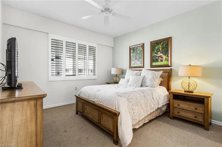 Bedroom with carpet floors and a ceiling fan