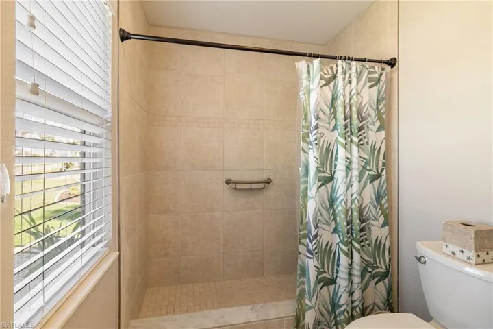 Bathroom featuring toilet and walk in shower