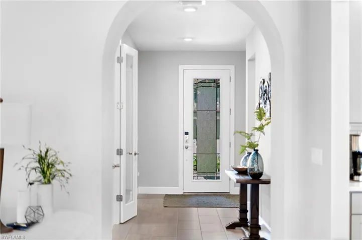 Foyer entrance with light tile patterned floors
