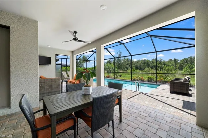 Sunroom featuring ceiling fan