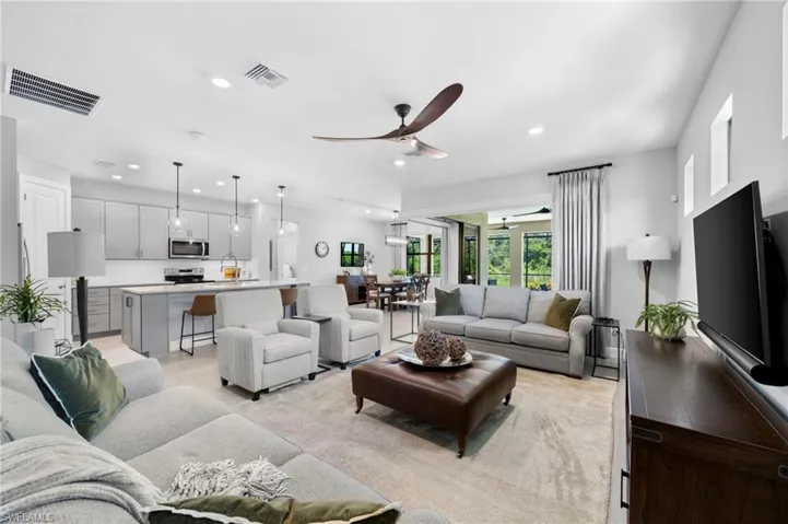 Living room featuring ceiling fan