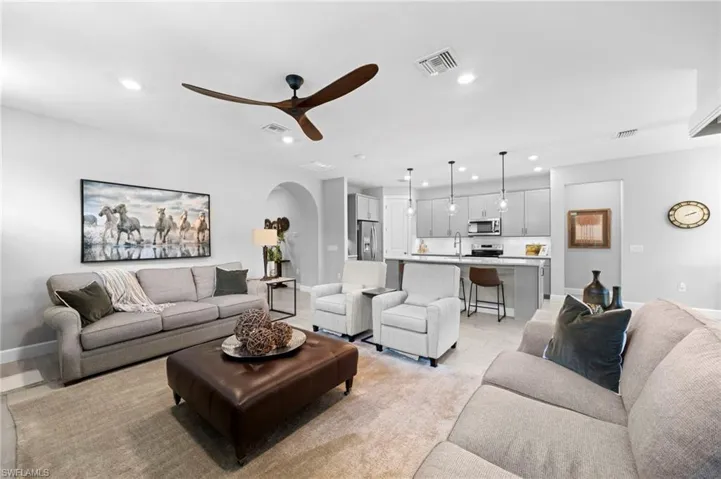 Living room featuring ceiling fan