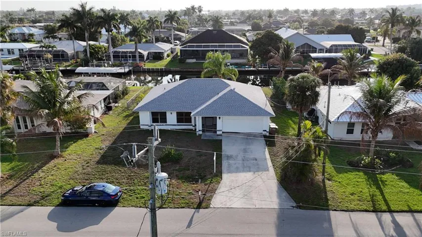 Aerial view of residential area with a large body of water