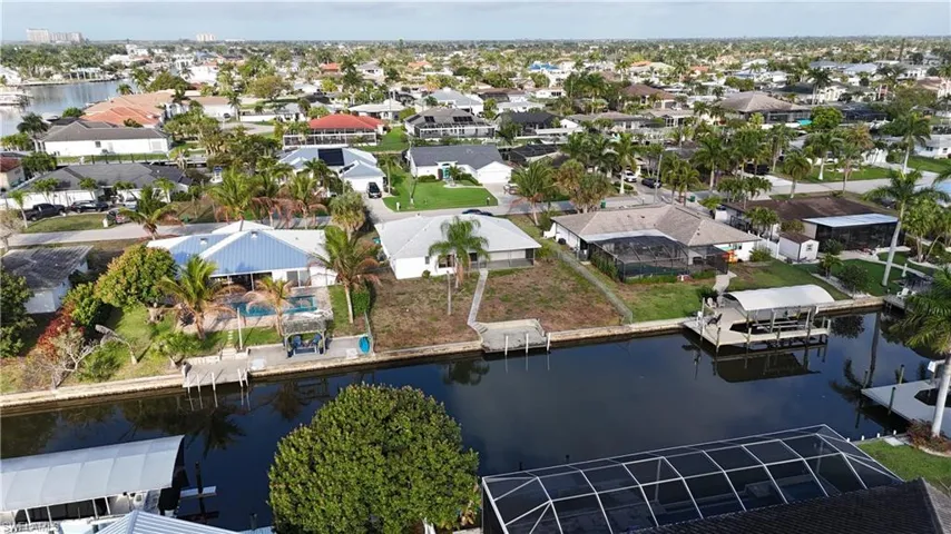 Aerial view of residential area with a nearby body of water