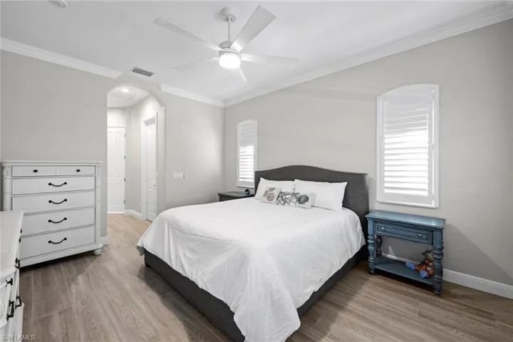 Hall leads to en-suite bath and two walk-in closets