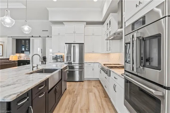 A long view of the kitchen and the large amount of cabinetry!