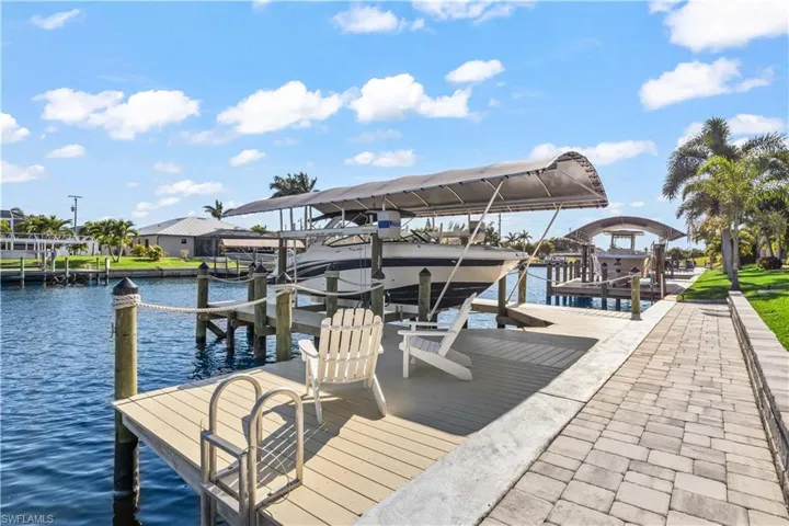 Whether you are a boater, a fisherman or just enjoy being outside, this outdoor layout offers the perfect spot to enjoy all of them!  Catch fish right off your dock, quick and easy access out the gulf and an extra long extended paved area for additional seating, kayaks etc.  There is also a ladder that makes getting into the water very easy!