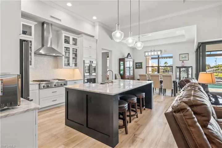 A DREAM kitchen - highly upgraded appliances including a double oven, gas cooktop and beautiful custom cabinetry with dual tones - not only functional but aesthetically gorgeous as well!