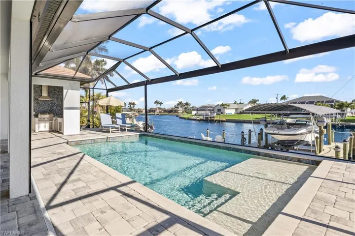 Sparkling pool with large sunledge and bubbler.  Beautiful intersecting canal views and your own outdoor oasis!
