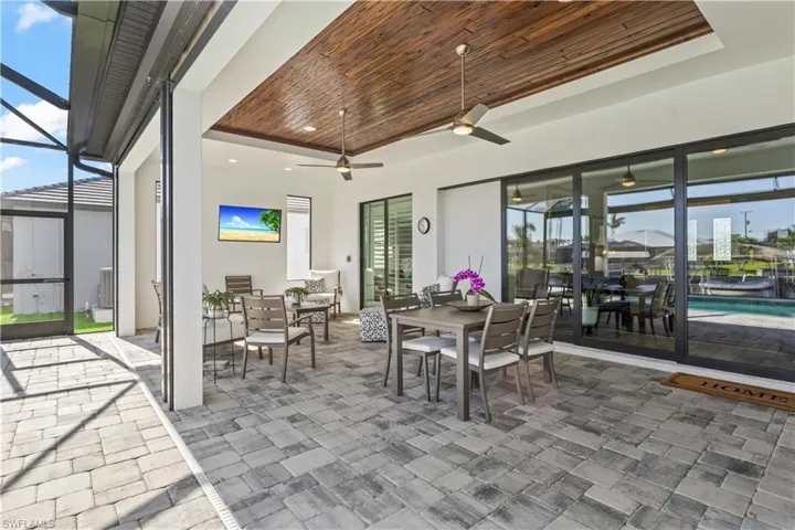 Triple sliders disappear opening the indoors outside and offering additional blended living space!