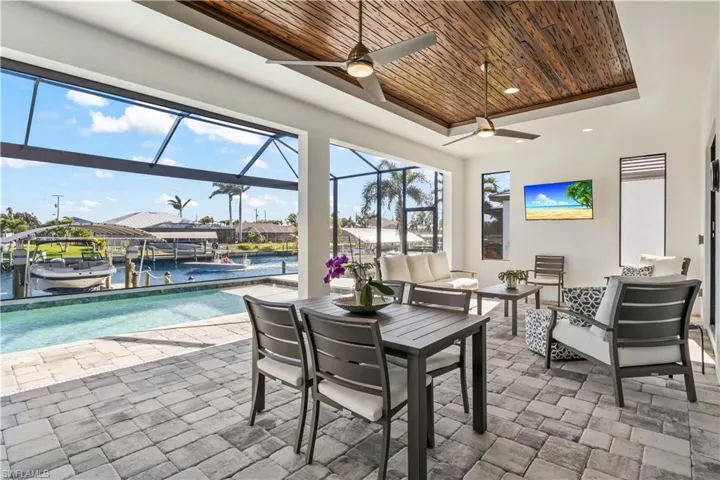 The under cover patio provides a perfect retreat for watching tv outdoors and a separate area for outdoor grilling!