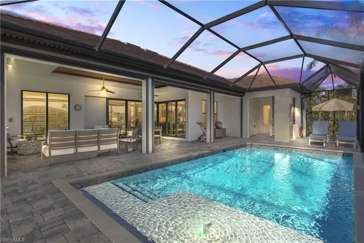 the outdoor area was designed with much thought - outdoor kitchen, outdoor shower, bathroom access and a large covered sitting and dining area - there are also electric screens for additional shade/protection.  This home has never come close to flooding and sits high and dry!
