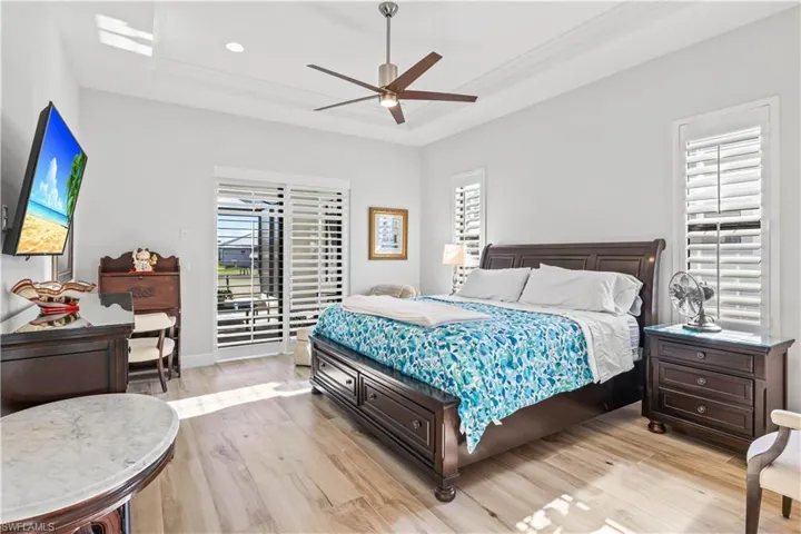 Large primary bedroom with double sliders out to the patio!  Split for privacy from the guest bedrooms and plenty of room for a sitting area!
