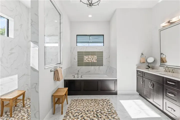 Better than a luxury spa!  Large walk in shower and serenity soaking tub with dual sinks and incredible tile accents!