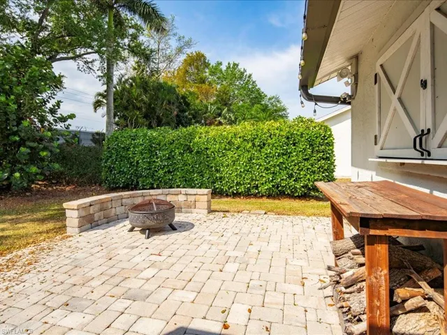 View of patio / terrace with an outdoor fire pit