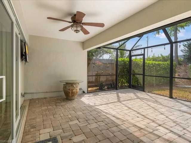Unfurnished sunroom with a ceiling fan