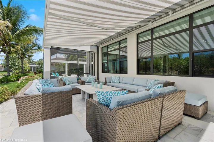 View of patio with an outdoor hangout area