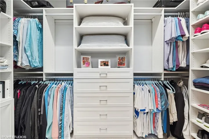 Spacious closet with carpet flooring