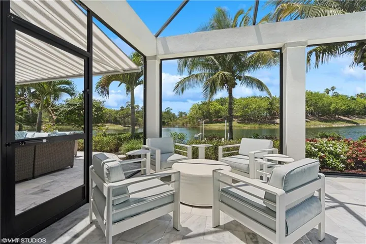Sunroom with a water view
