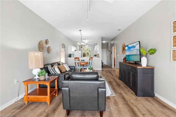 Living room featuring a chandelier and light wood-type flooring