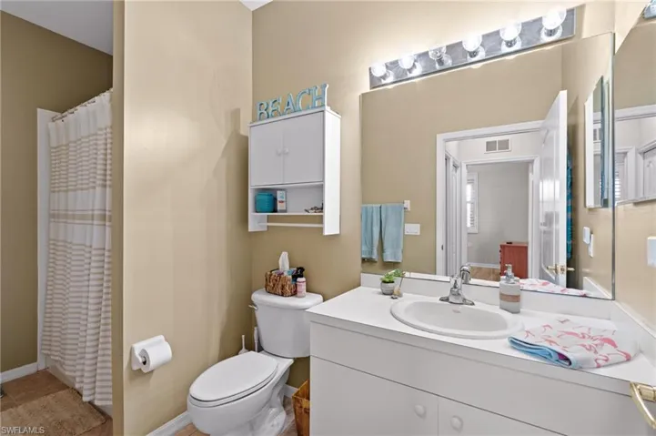 Bathroom featuring vanity and toilet