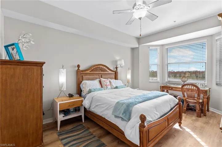 Bedroom with light wood-type flooring and ceiling fan