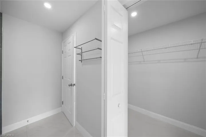 Spacious closet featuring tile floors