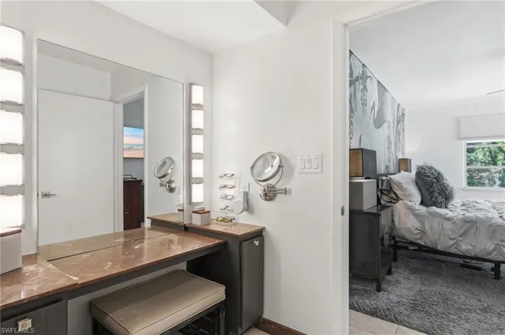 Integrated vanity with a polished countertop and built-in cabinetry
