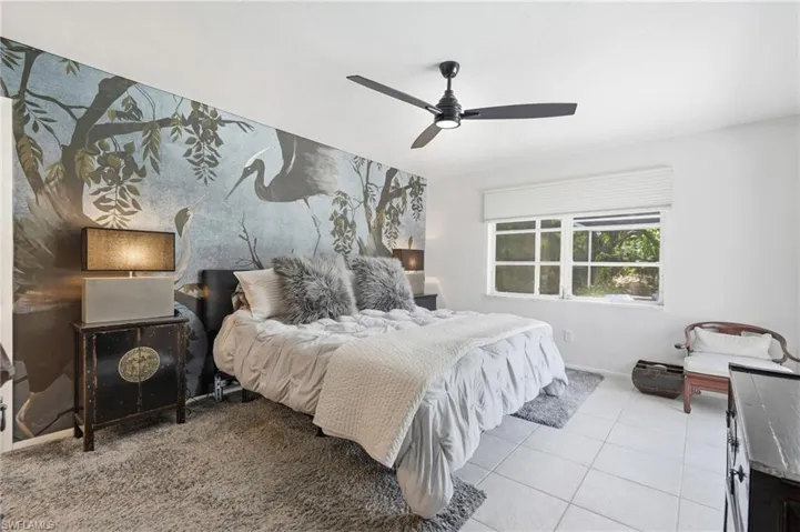Accent wall with an avian and botanical mural