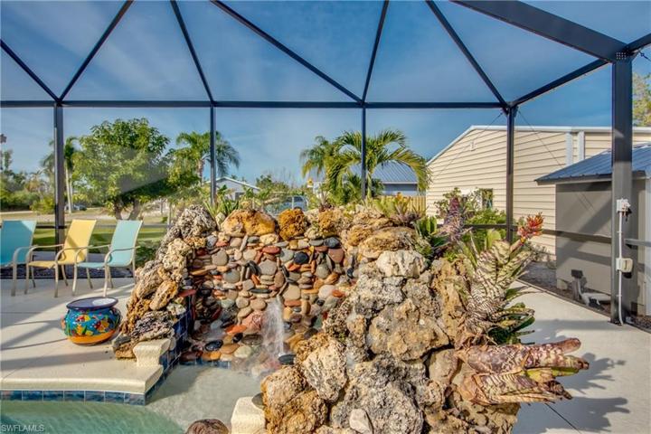 Rock feature with waterfall by the pool