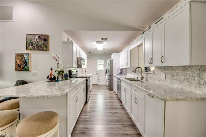Nice kitchen with bar and lot of work space.