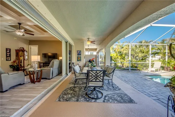 View of patio / terrace with ceiling fan and a lanai