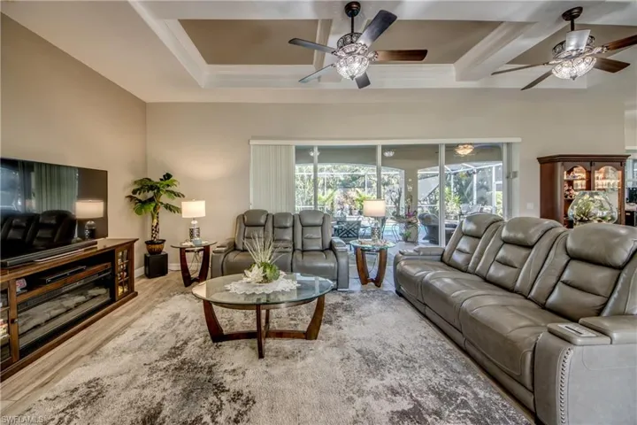 Living room featuring hardwood / wood-style floors and ceiling fan
