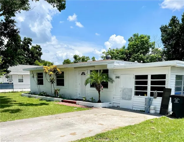 Ranch-style home with a front yard