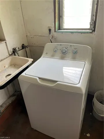 Clothes washing area with washer / clothes dryer