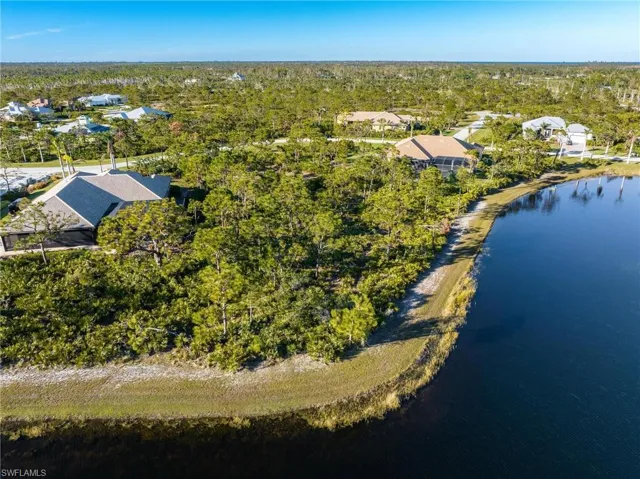 View of property location featuring nearby suburban area and a nearby body of water