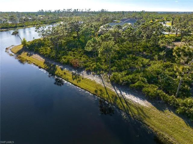 Aerial overview of property's location featuring a nearby body of water