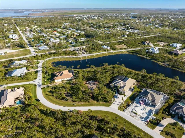 View of property location with nearby suburban area and a large body of water