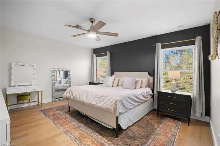 Bedroom featuring light wood-type flooring and ceiling fan